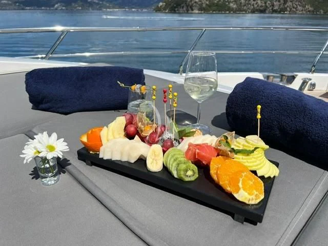 a tray of food on a boat aboard HUBO Yacht for Sale