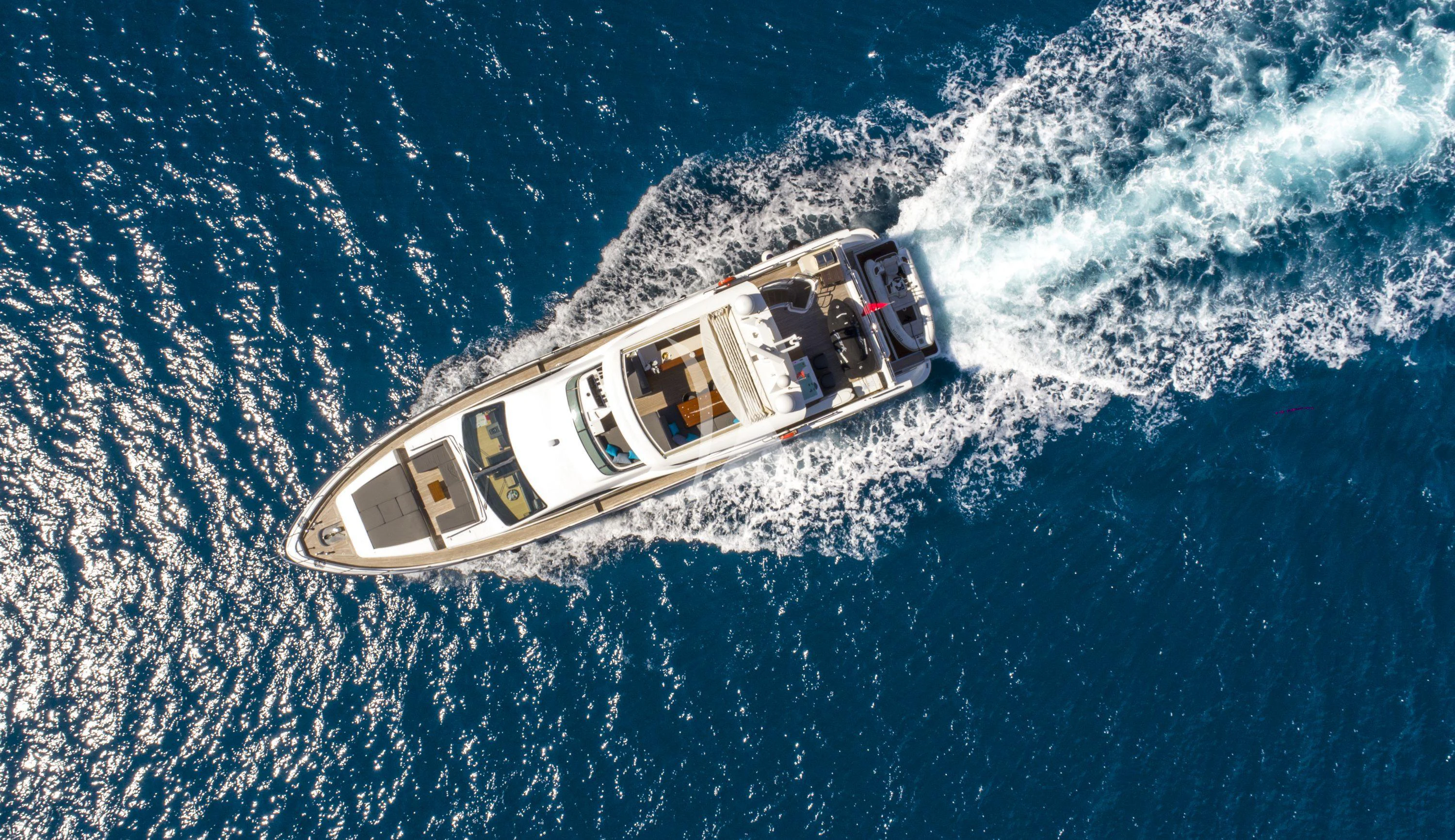 a boat in the water aboard HUBO Yacht for Sale