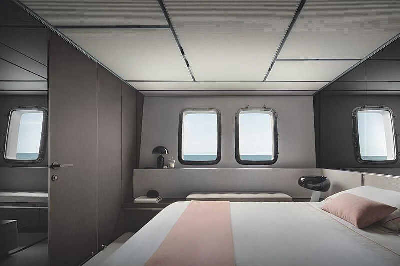 a room with a bed and a window aboard SUNDANCE Yacht for Sale