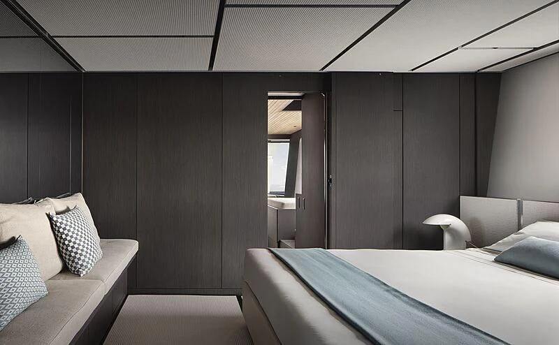a room with a bed and a couch aboard SUNDANCE Yacht for Sale