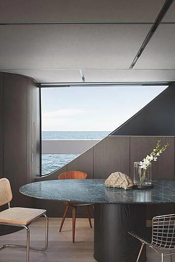 a room with a table and chairs aboard SUNDANCE Yacht for Sale