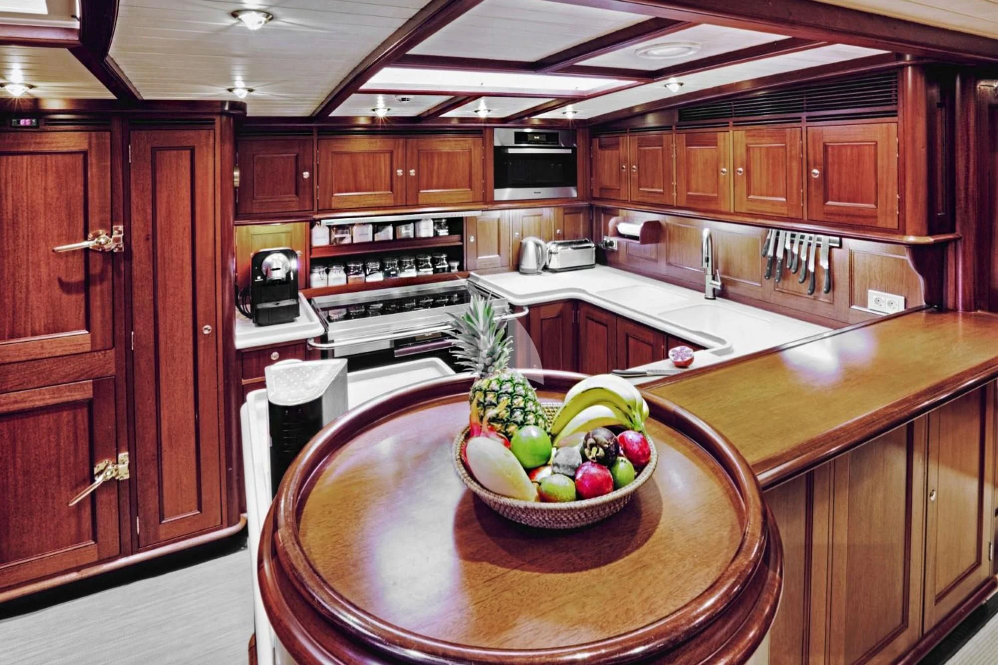 a bowl of fruit on a counter aboard SHAMOUN Yacht for Sale
