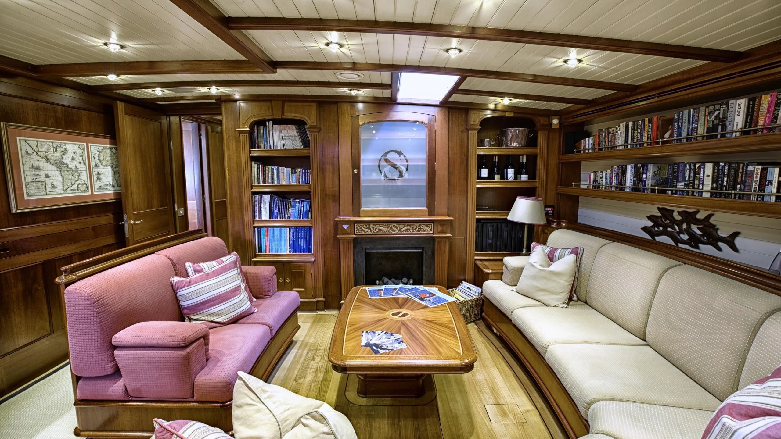 a living room with a fireplace aboard SHAMOUN Yacht for Sale
