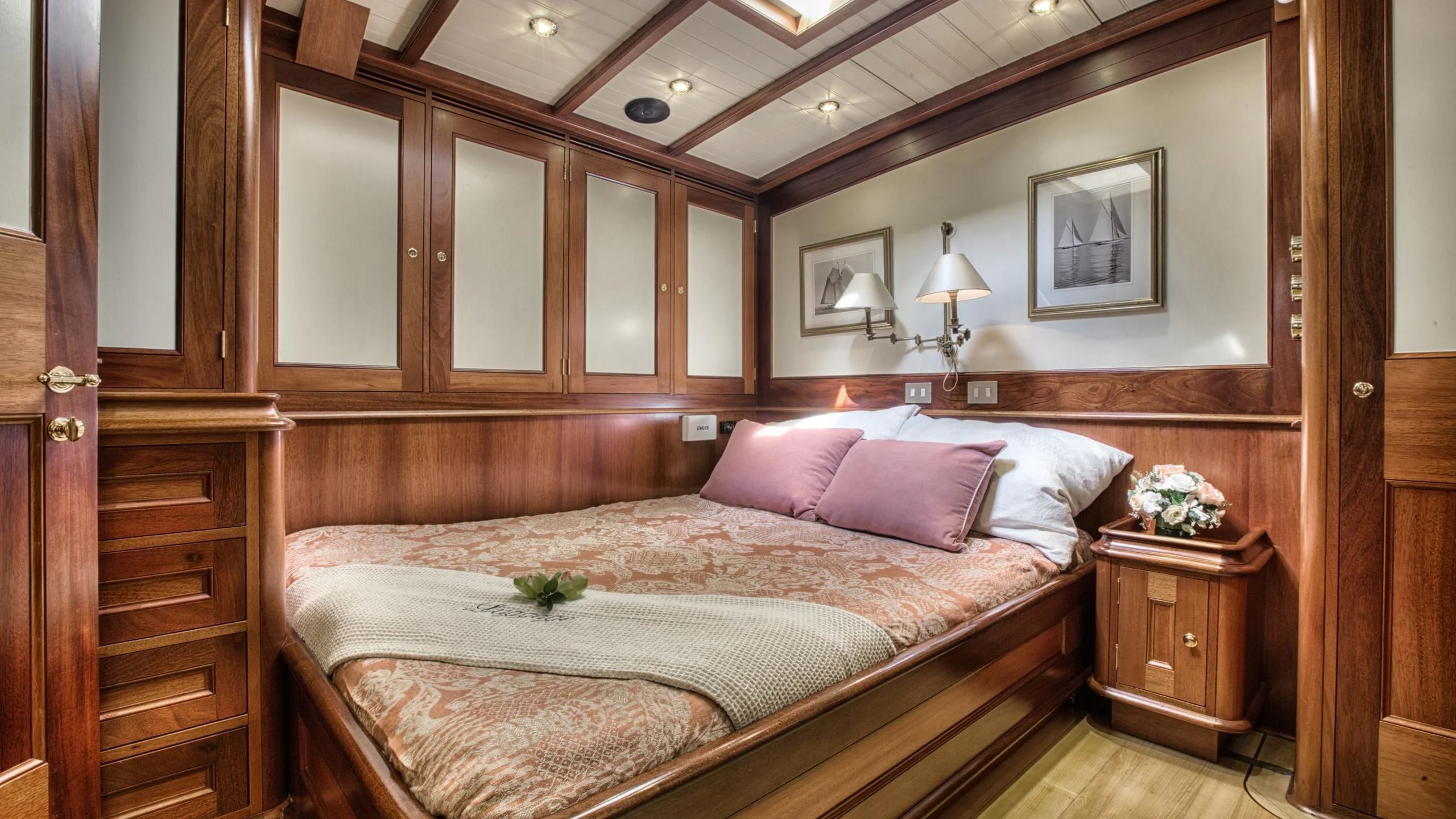 a bed with pink pillows aboard SHAMOUN Yacht for Sale