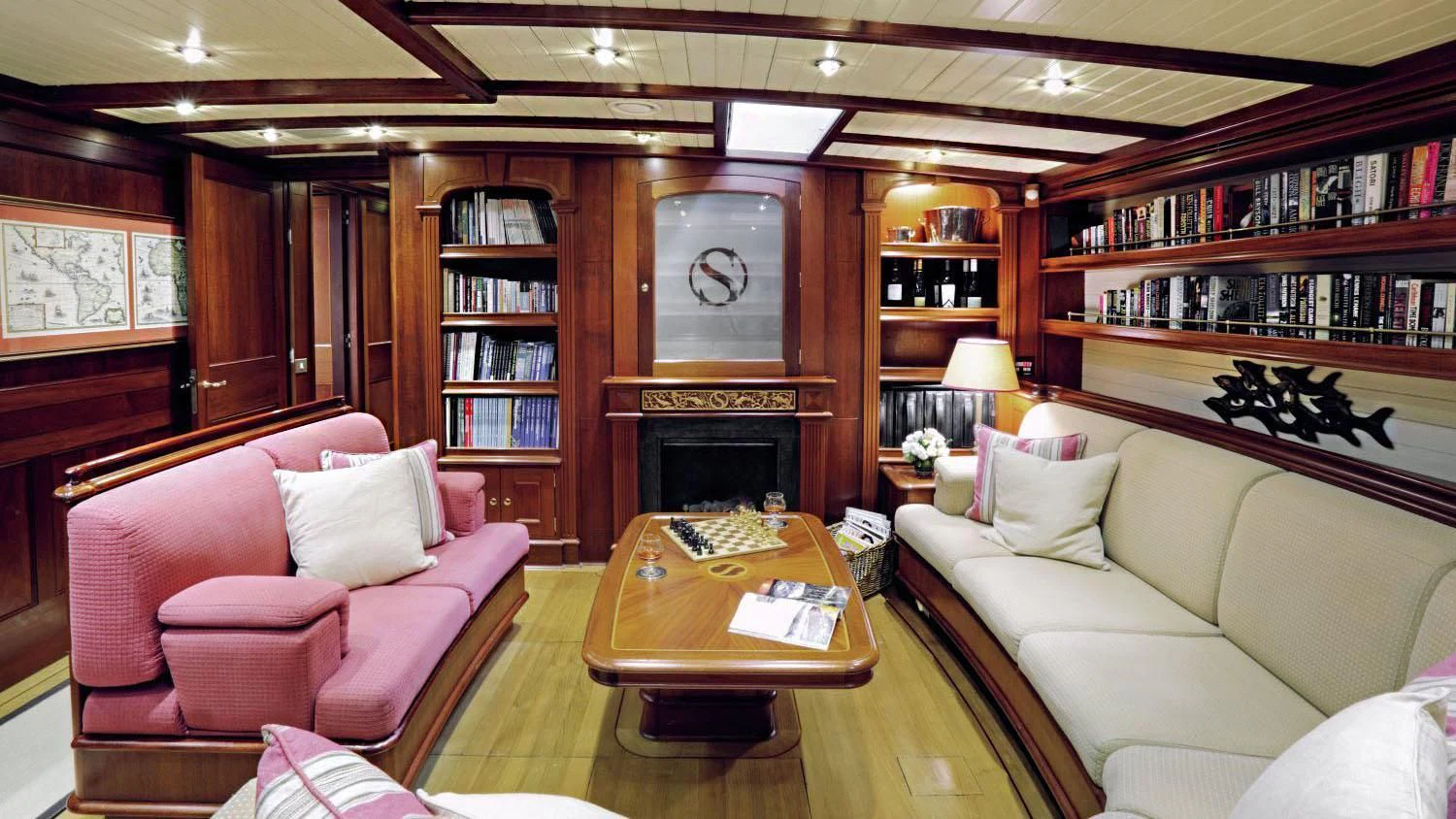 a living room with a fireplace aboard SHAMOUN Yacht for Sale