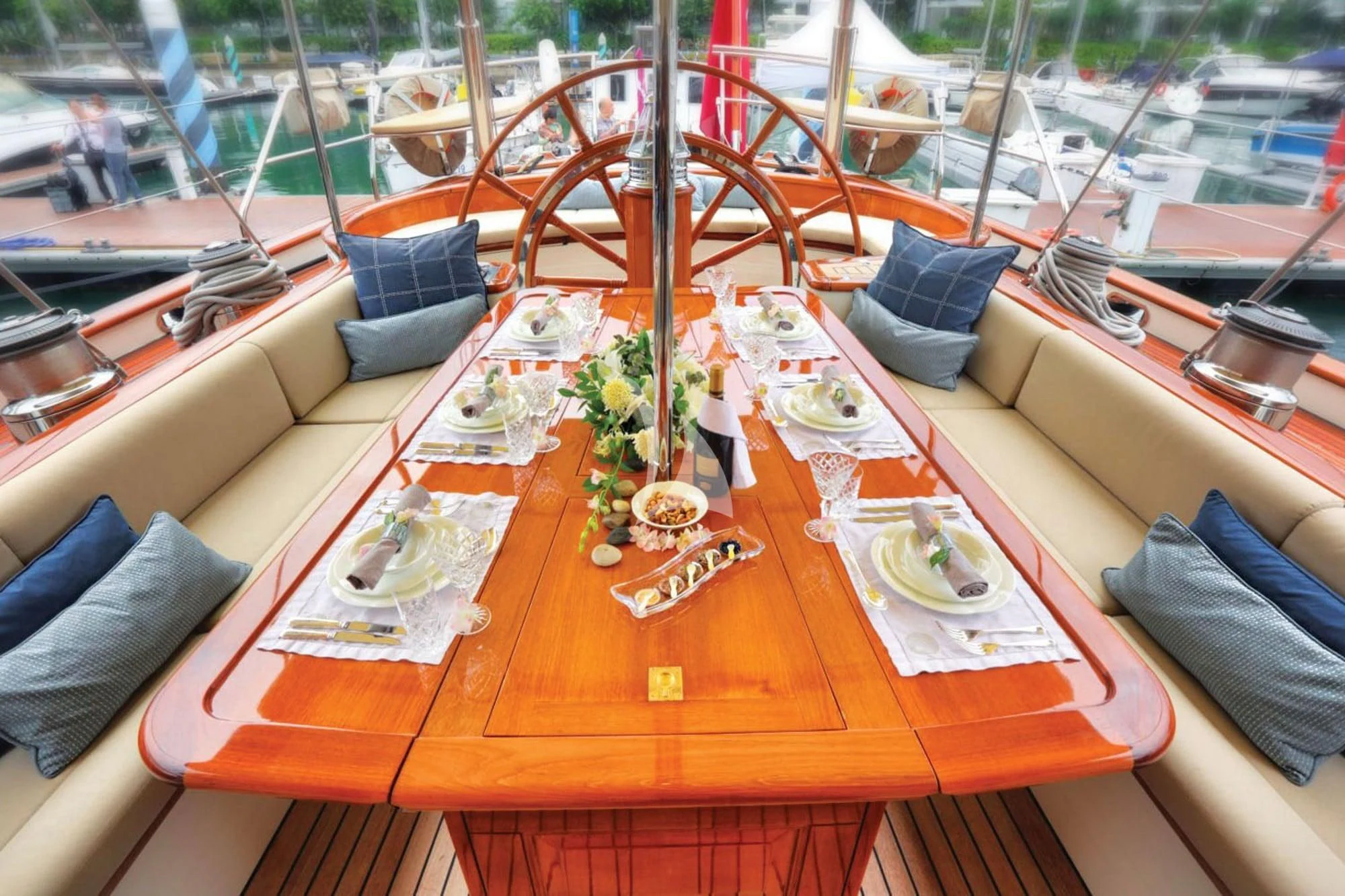 a table with plates and food on it aboard SHAMOUN Yacht for Sale
