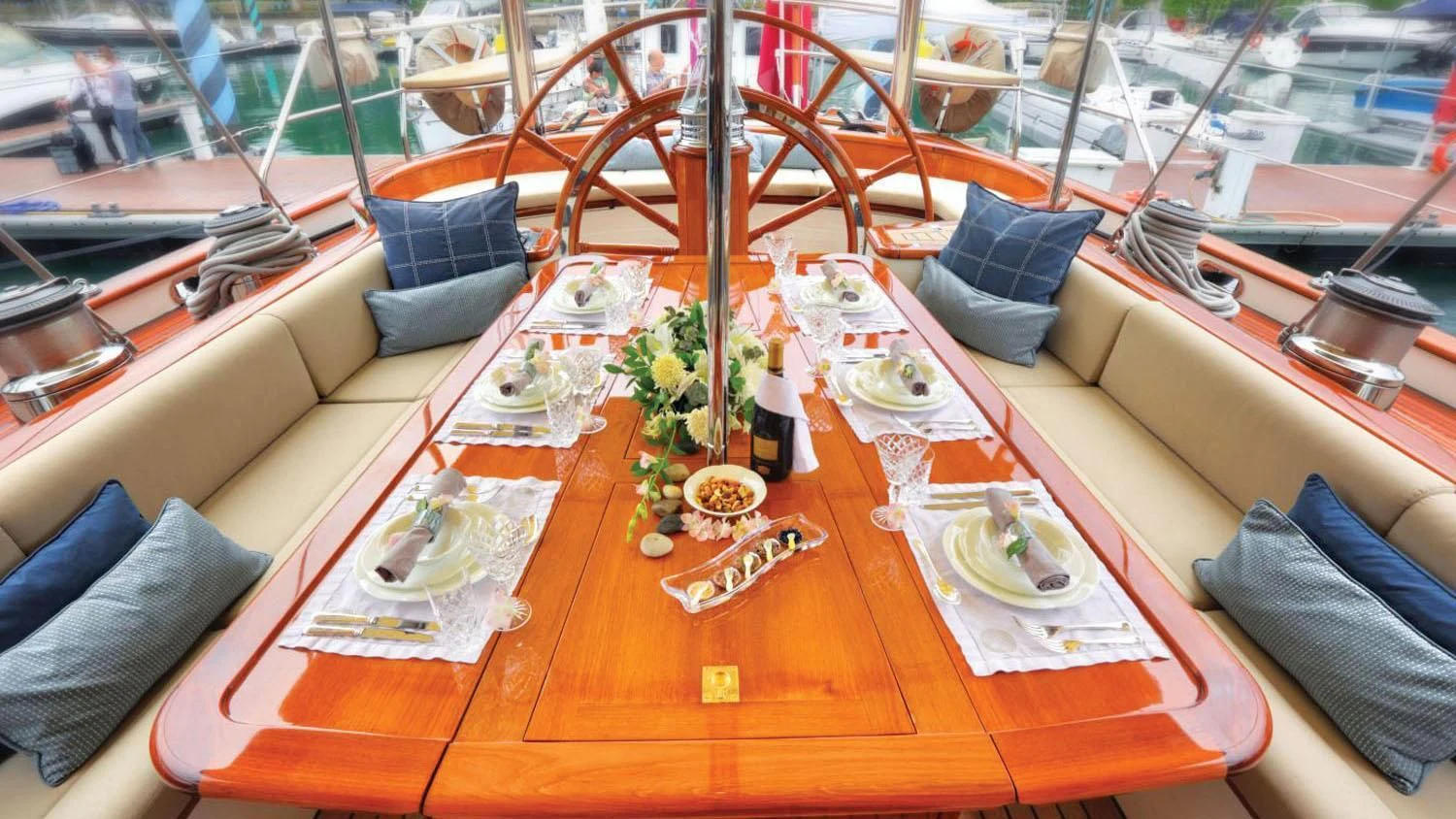 a boat with a table cloth and chairs on it aboard SHAMOUN Yacht for Sale