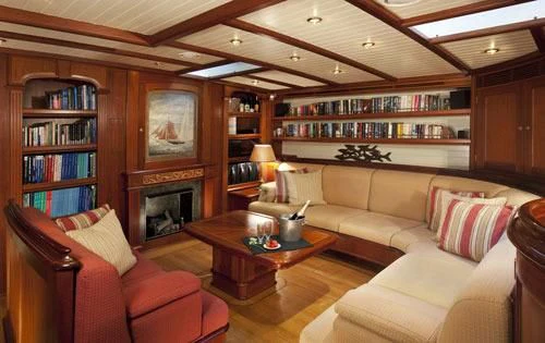 a living room with a fireplace aboard SHAMOUN Yacht for Sale