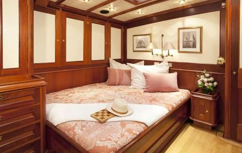 a bed with a hat on it aboard SHAMOUN Yacht for Sale