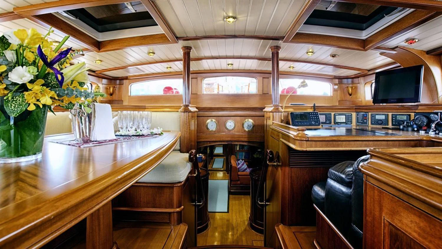 a room with a table and chairs aboard SHAMOUN Yacht for Sale