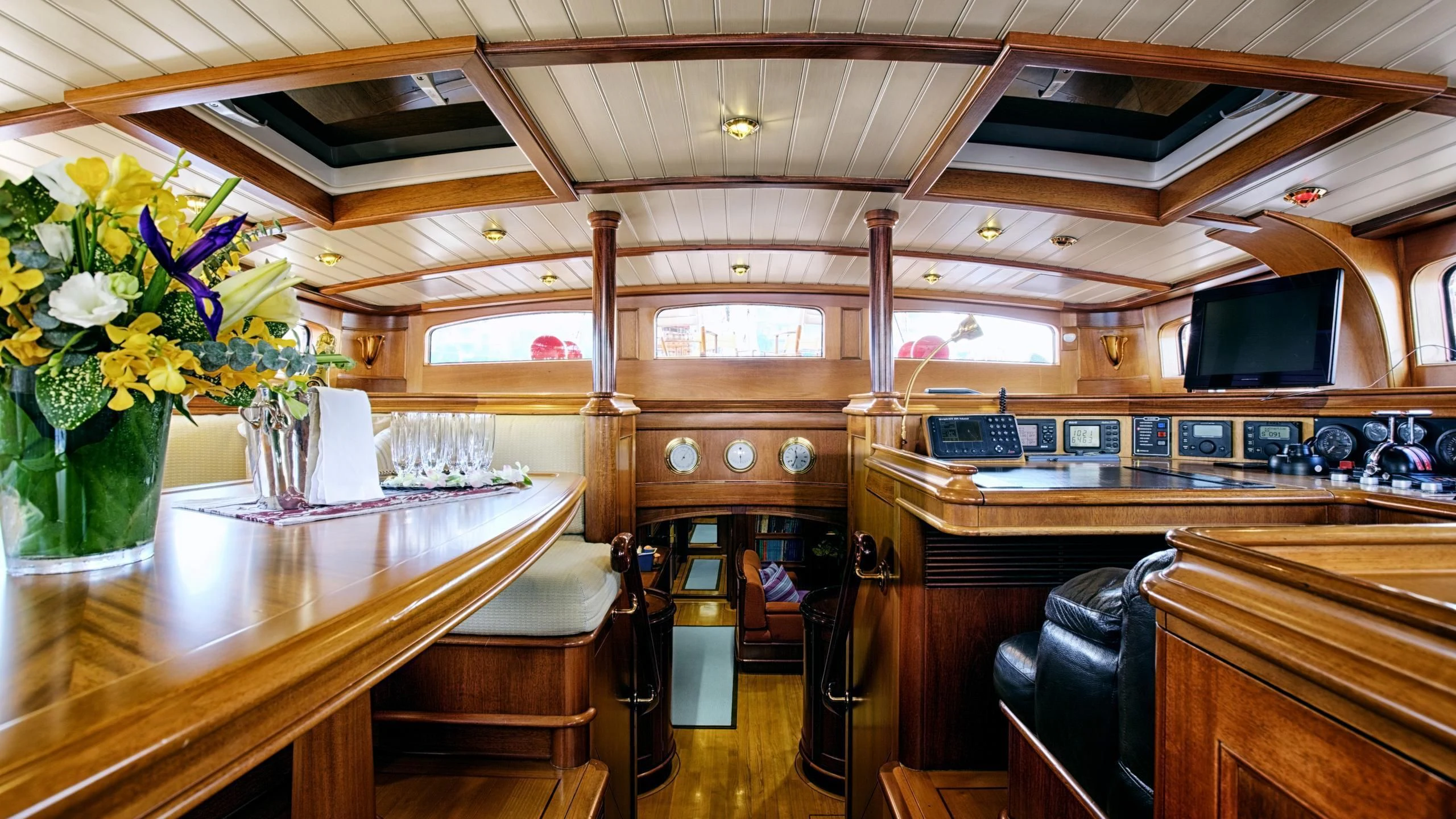 a room with a table and chairs aboard SHAMOUN Yacht for Sale