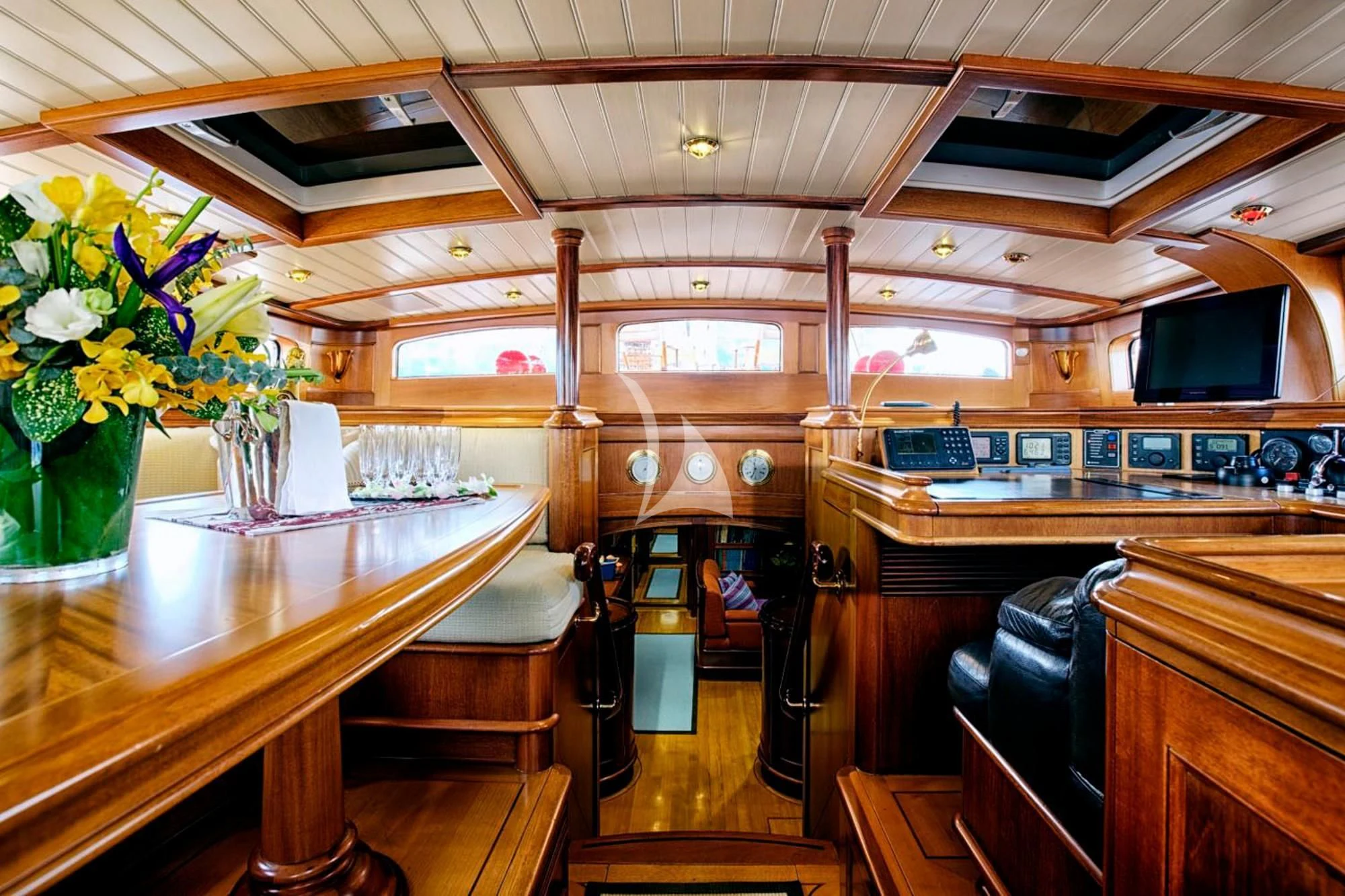 a room with a table and chairs aboard SHAMOUN Yacht for Sale