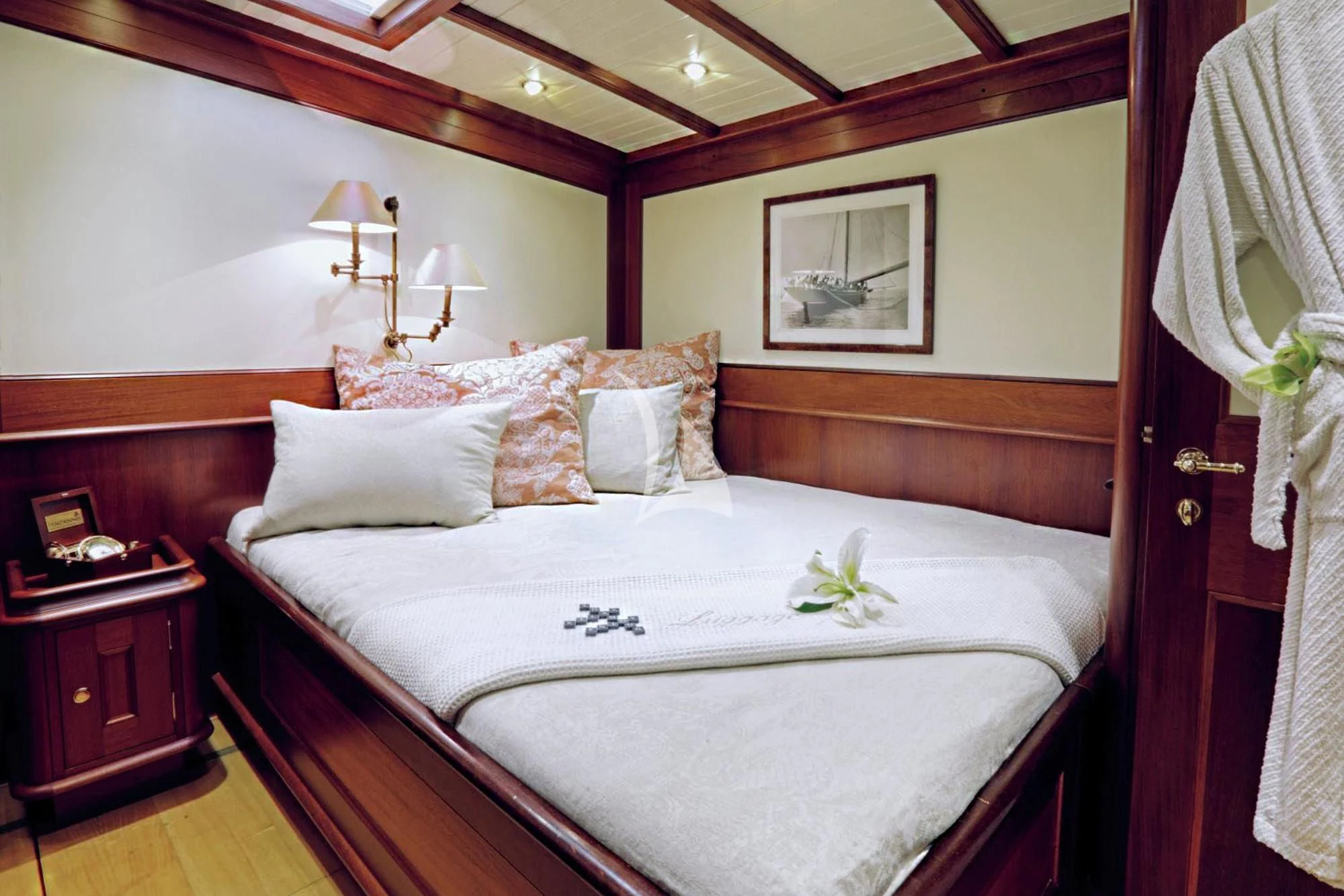 a bed with a white sheet and a white pillow aboard SHAMOUN Yacht for Sale