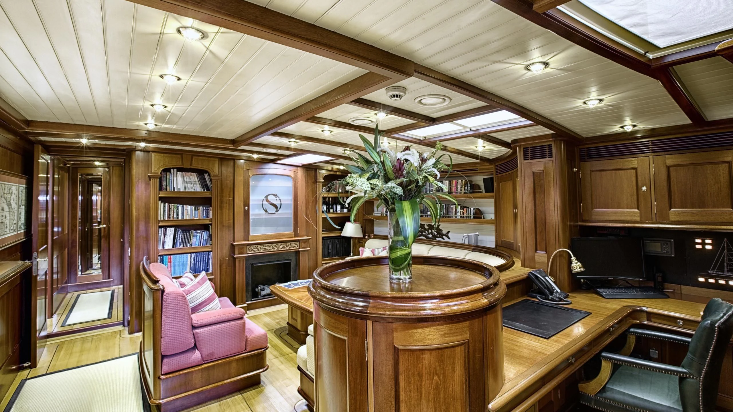 a large room with a table and chairs aboard SHAMOUN Yacht for Sale