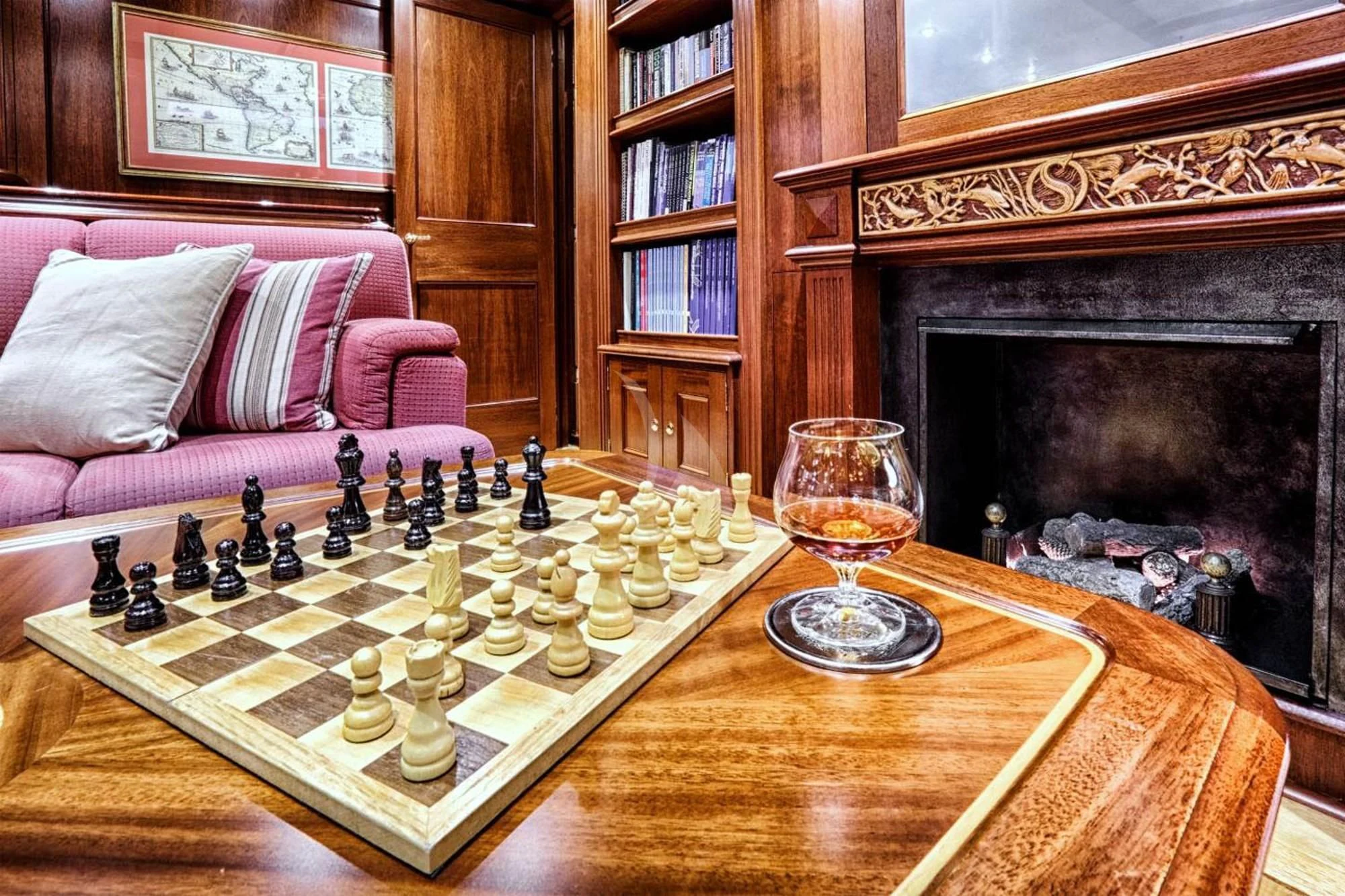 a chess board and a glass of chess on a table aboard SHAMOUN Yacht for Sale