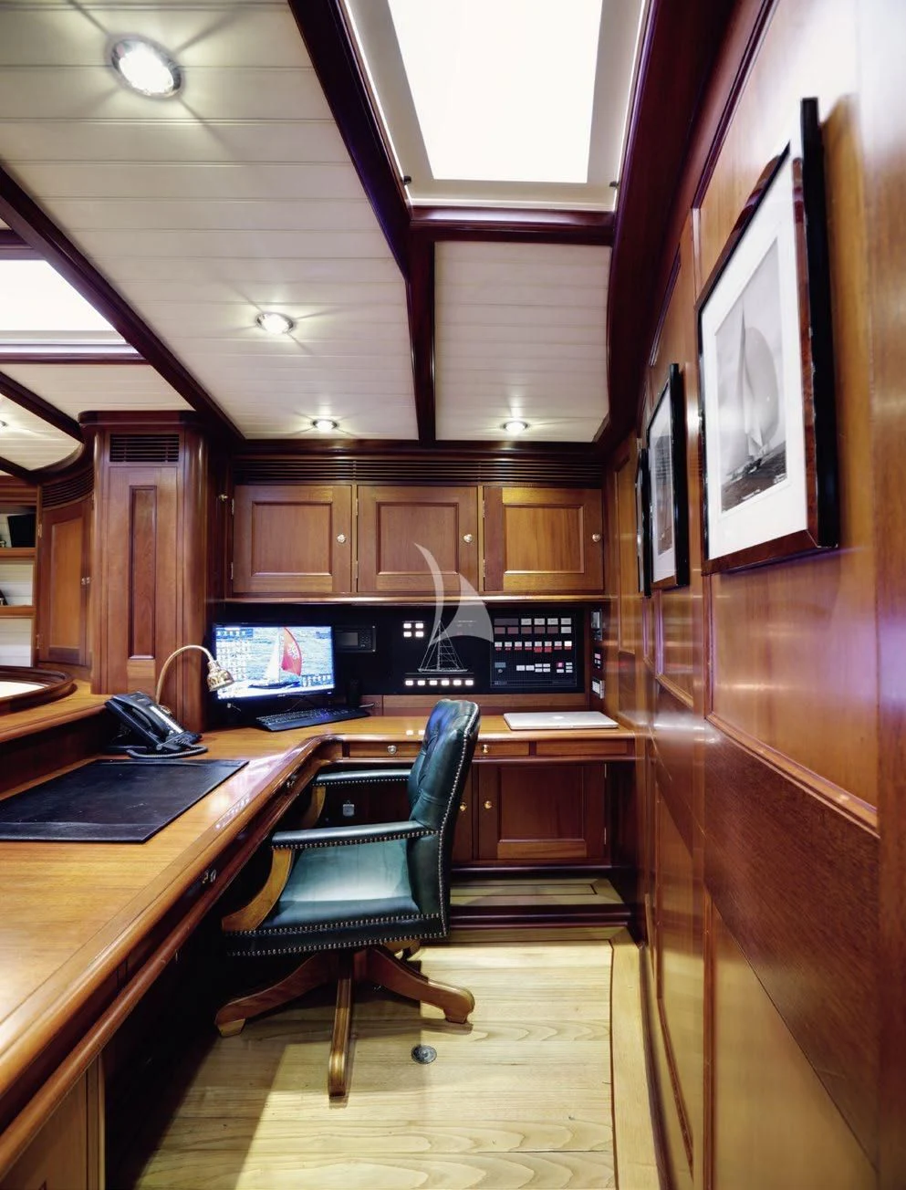 a room with a desk and chairs aboard SHAMOUN Yacht for Sale