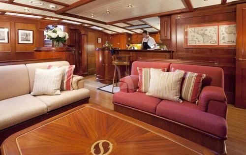 a living room with a couch and a table aboard SHAMOUN Yacht for Sale
