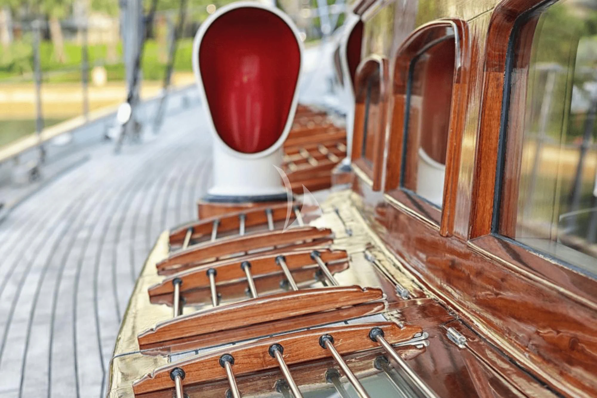 a red cylindrical object on a wooden surface aboard SHAMOUN Yacht for Sale