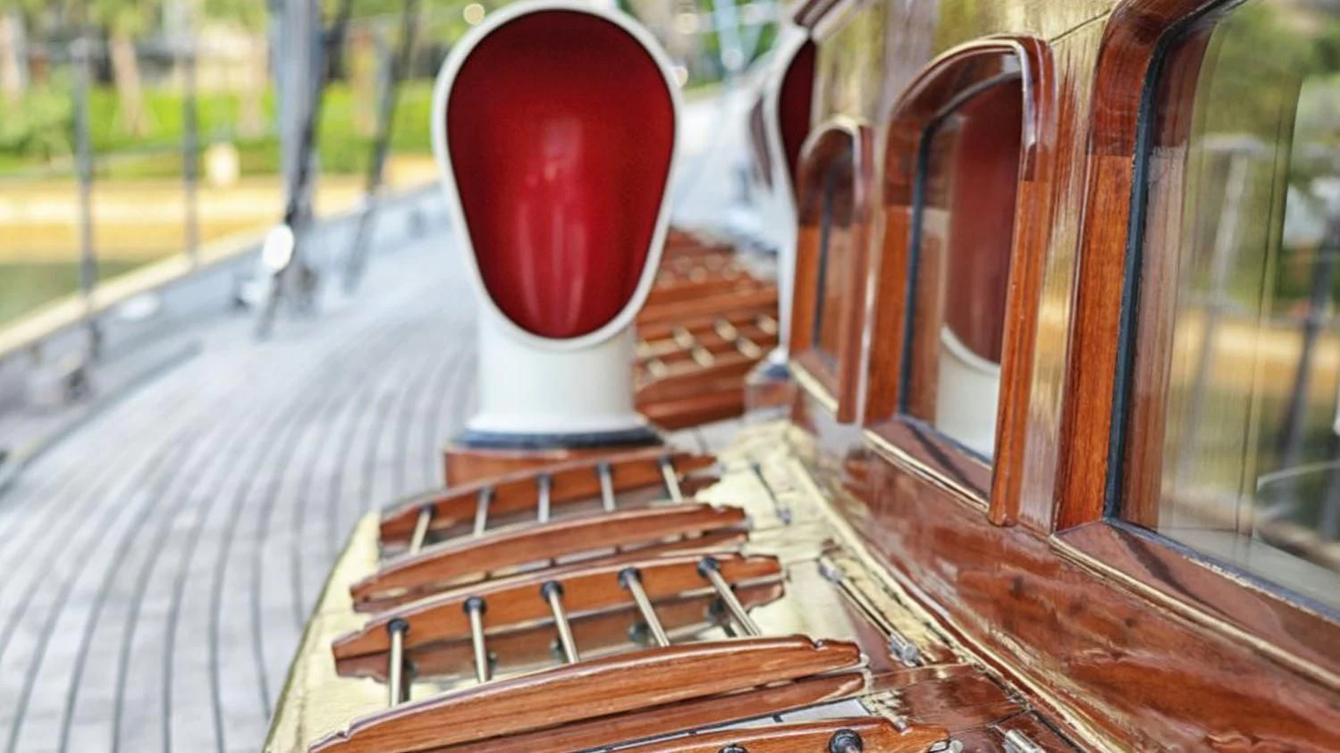 a red cylindrical object on a wooden surface aboard SHAMOUN Yacht for Sale