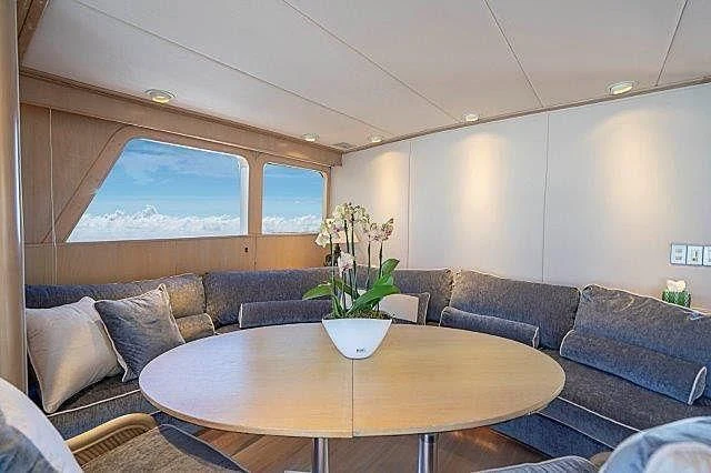 a living room with a couch and a table aboard IVORY LADY Yacht for Sale