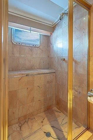 a bathroom with a window aboard IVORY LADY Yacht for Sale