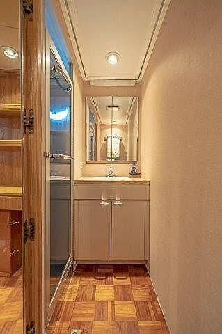 a bathroom with a sink and a mirror aboard IVORY LADY Yacht for Sale
