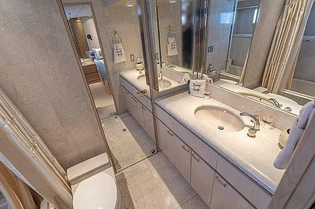 a bathroom with a sink and a toilet aboard IVORY LADY Yacht for Sale