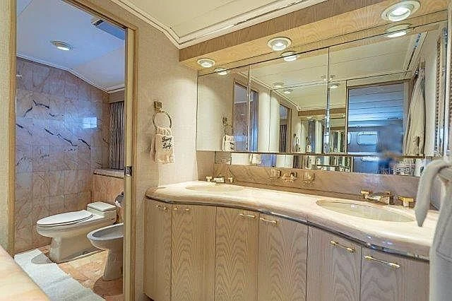 a bathroom with a large mirror aboard IVORY LADY Yacht for Sale