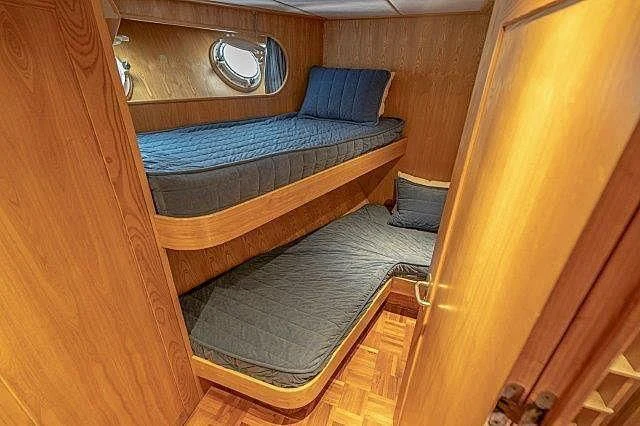 a bed in a room aboard IVORY LADY Yacht for Sale