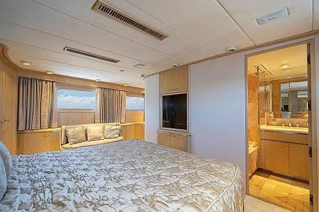 a bedroom with a bed aboard IVORY LADY Yacht for Sale