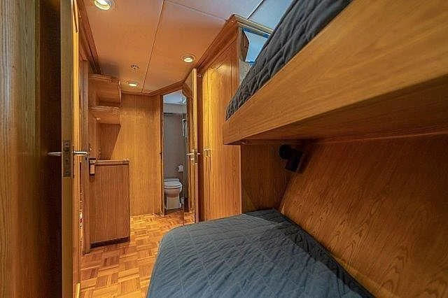 a bed in a room aboard IVORY LADY Yacht for Sale