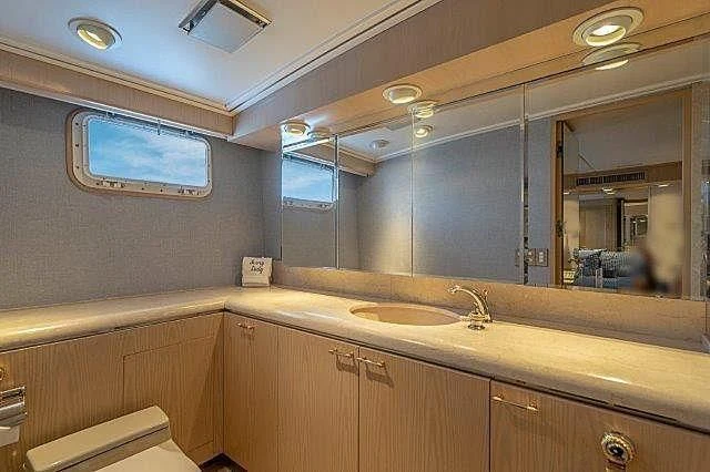 a bathroom with a large mirror aboard IVORY LADY Yacht for Sale