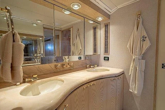 a bathroom with a large mirror aboard IVORY LADY Yacht for Sale