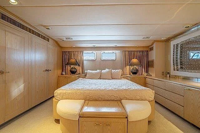 a large bedroom with a bed aboard IVORY LADY Yacht for Sale