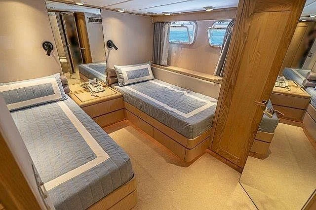 a bed in a room aboard IVORY LADY Yacht for Sale