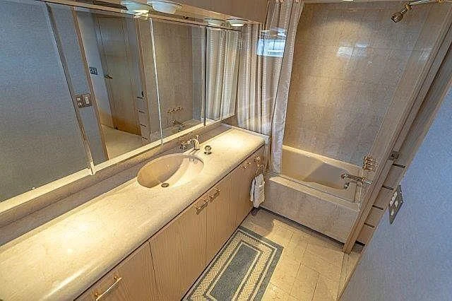 a bathroom with a sink and a mirror aboard IVORY LADY Yacht for Sale