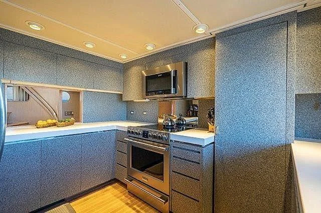 a kitchen with a microwave oven and a microwave aboard IVORY LADY Yacht for Sale