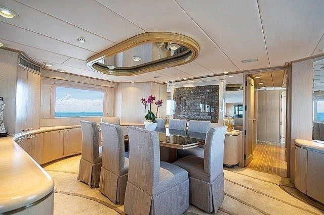a large living room with a large chandelier aboard IVORY LADY Yacht for Sale
