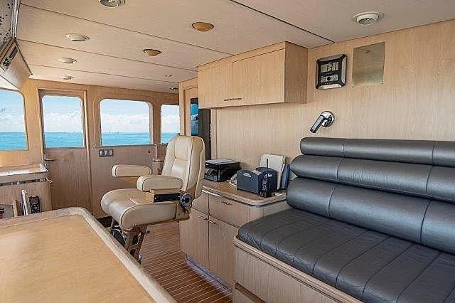 a living room with a couch and a tv aboard IVORY LADY Yacht for Sale