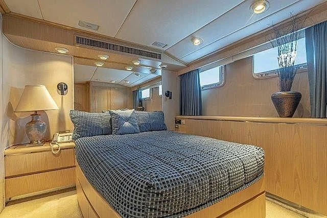 a bed in a room aboard IVORY LADY Yacht for Sale