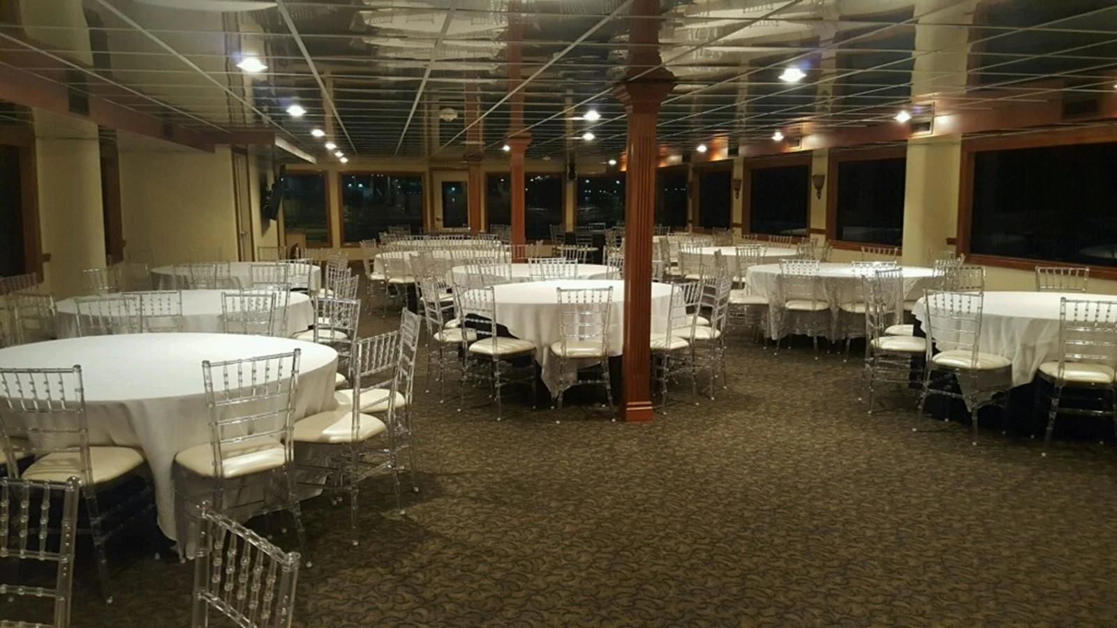a room with tables and chairs aboard SIR WINSTON Yacht for Sale