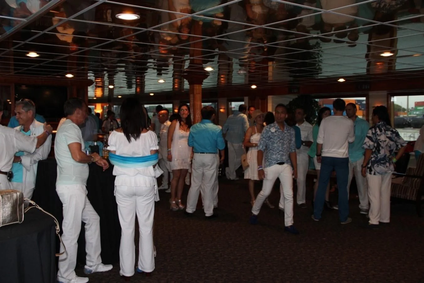 a group of people in a room aboard SIR WINSTON Yacht for Sale