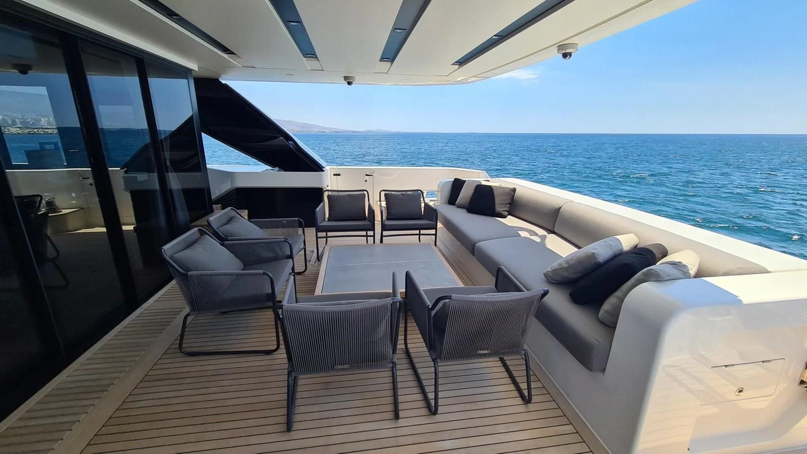 a deck with chairs and a large body of water aboard 2021 SANLORENZO SD96 #95 Yacht for Sale