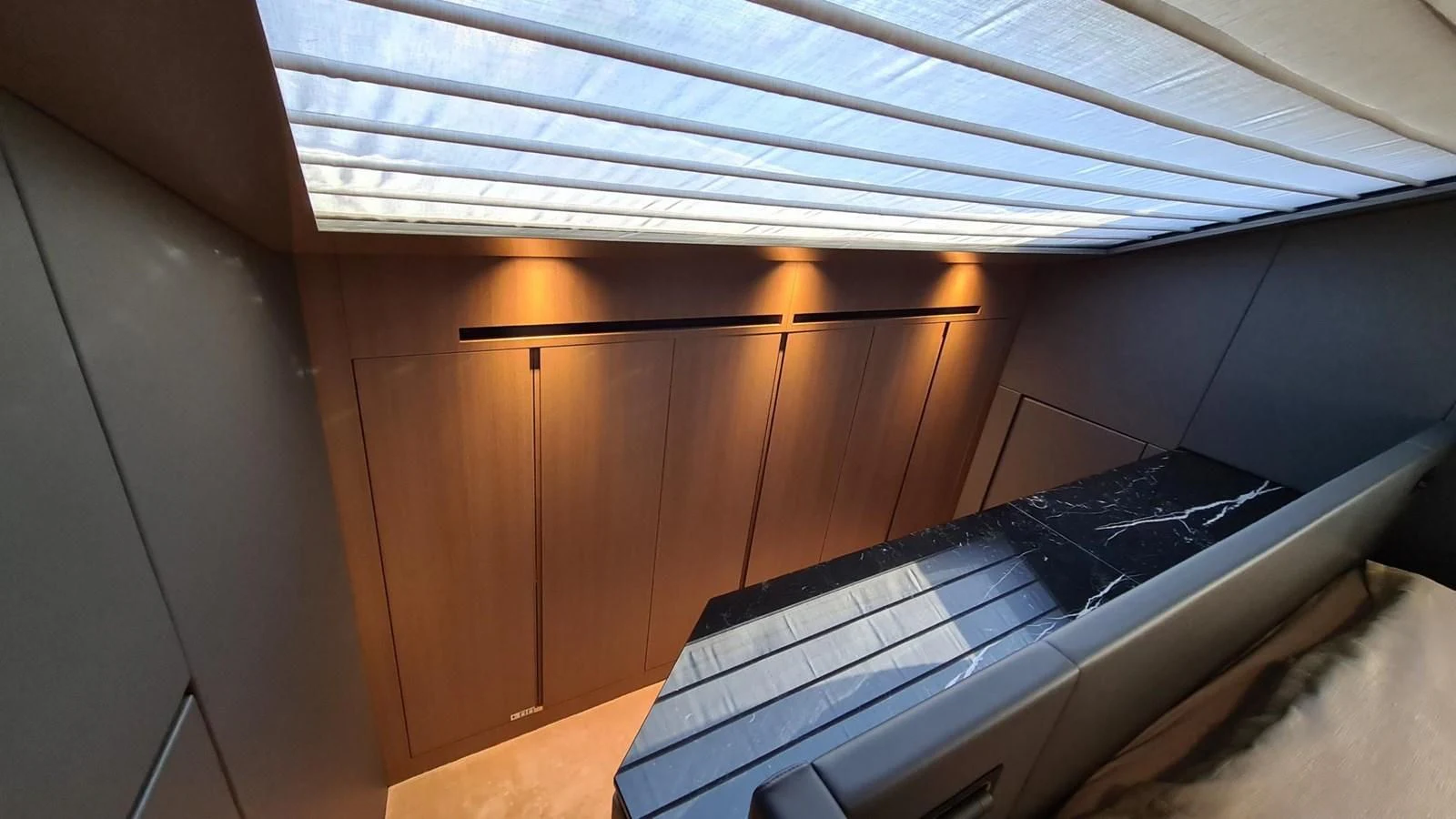 a room with a bed and a desk aboard 2021 SANLORENZO SD96 #95 Yacht for Sale