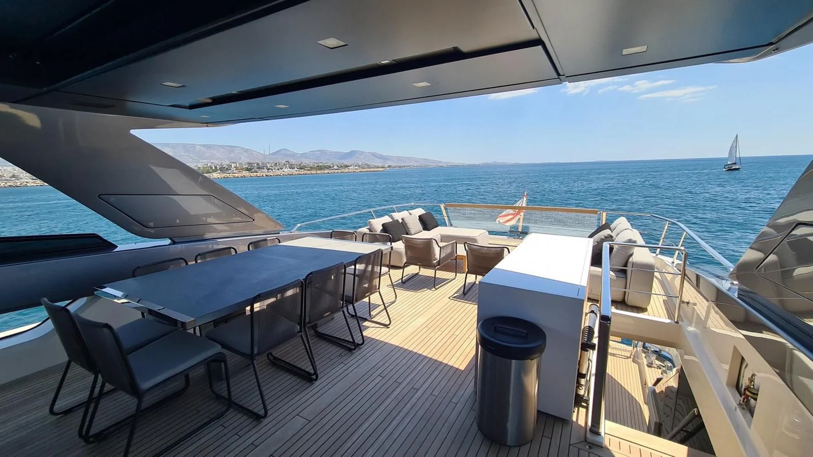 a deck with chairs and tables on it aboard 2021 SANLORENZO SD96 #95 Yacht for Sale