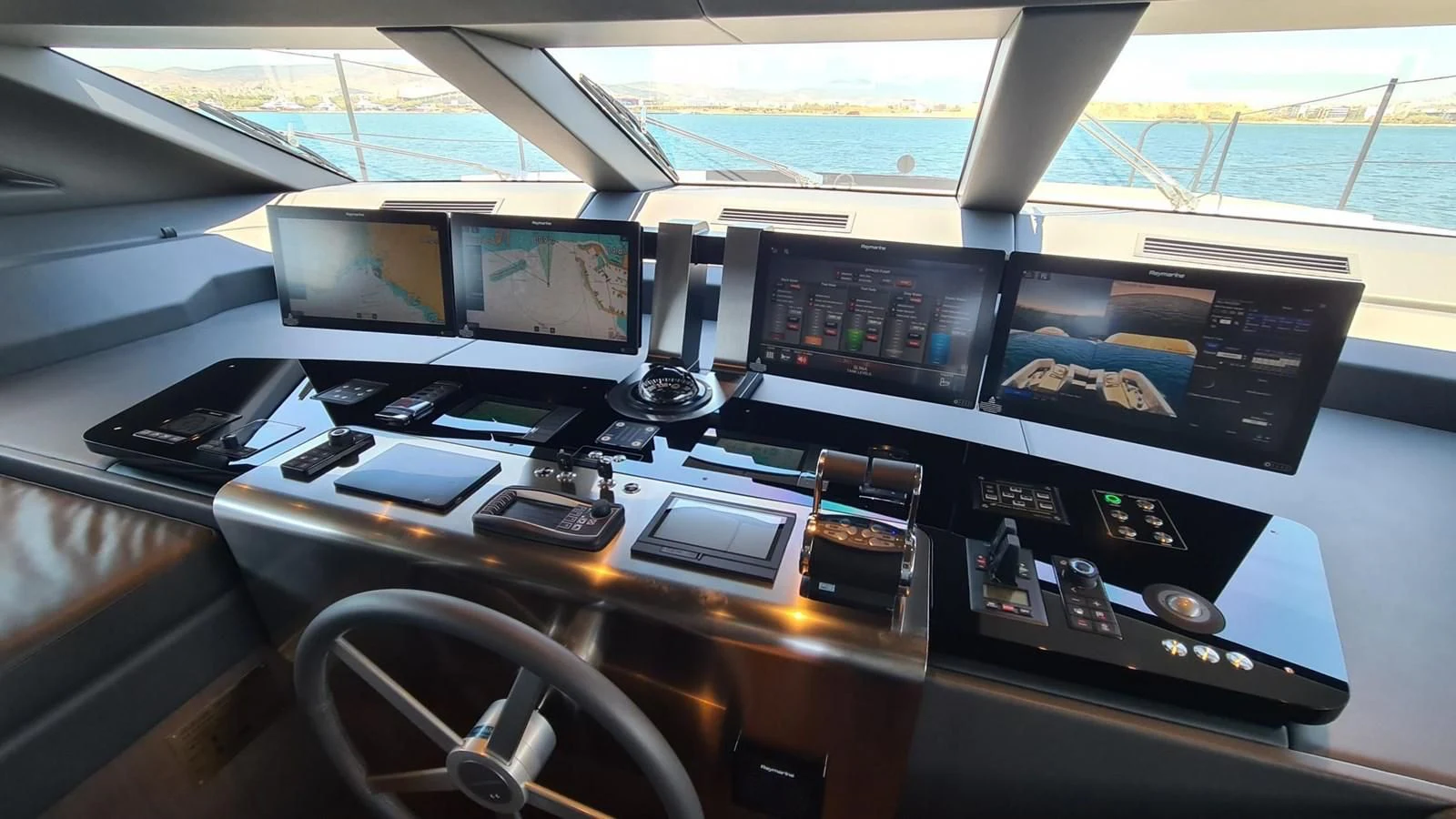 a row of computers on a table aboard 2021 SANLORENZO SD96 #95 Yacht for Sale