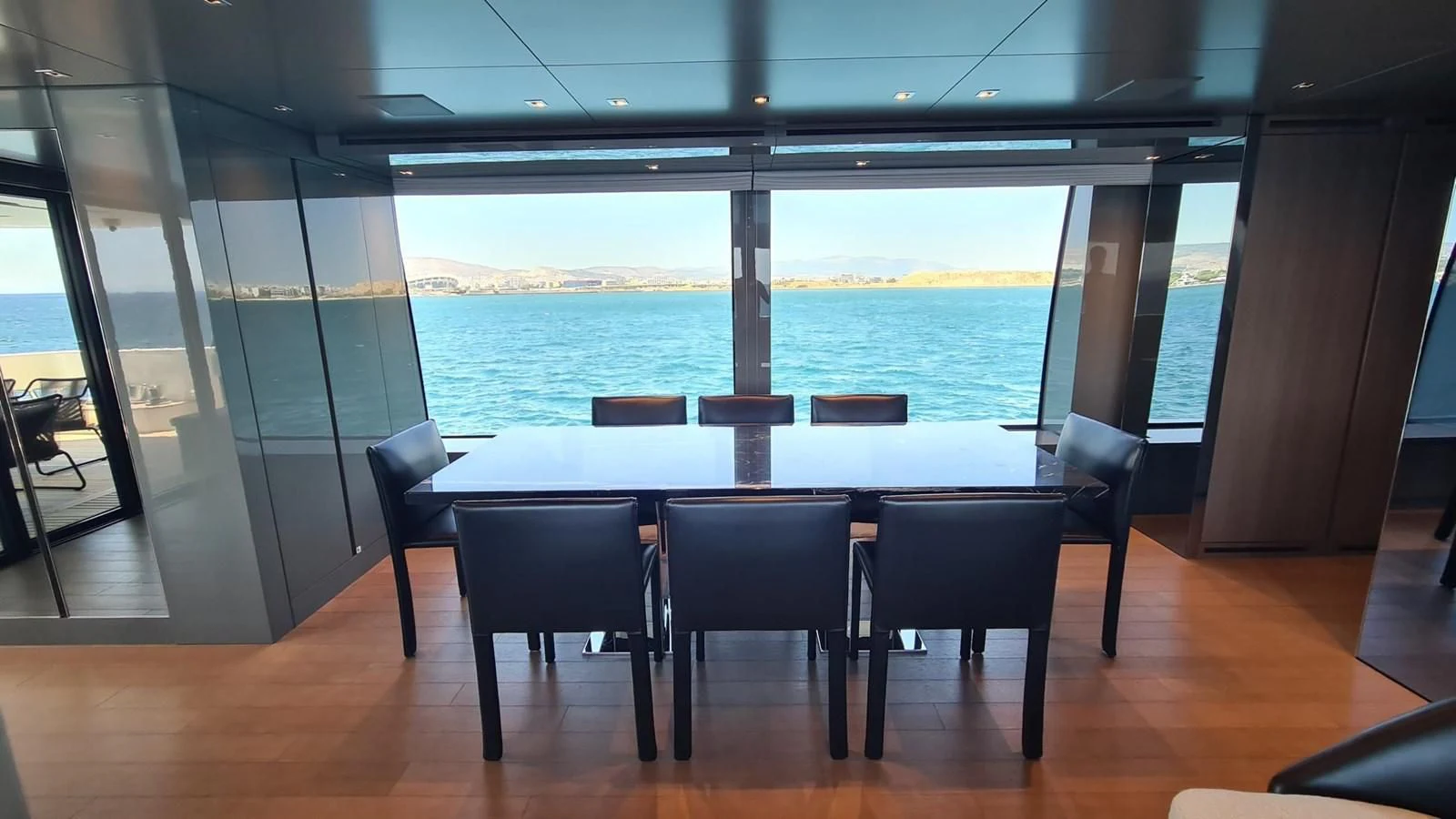 a table and chairs in a room aboard 2021 SANLORENZO SD96 #95 Yacht for Sale