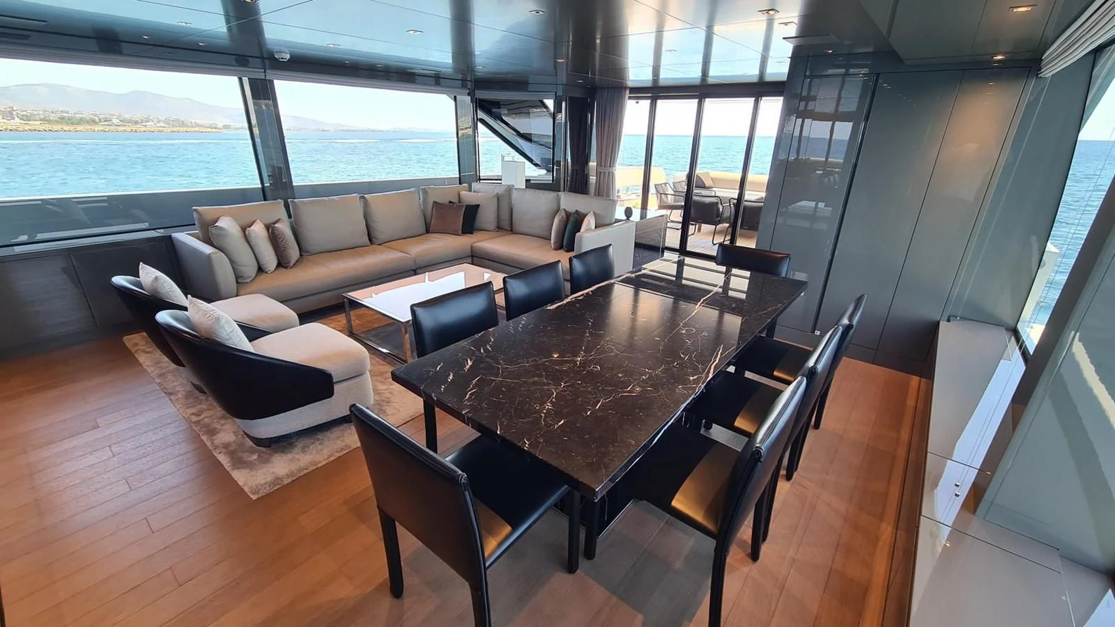 a living room with a large window aboard 2021 SANLORENZO SD96 #95 Yacht for Sale