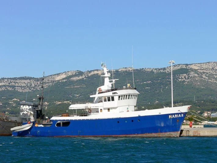 a large blue and white boat aboard MAYA'S DUGONG Yacht for Sale