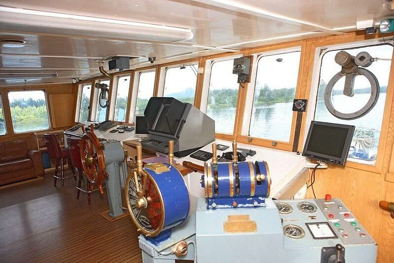 a room with a large blue wheel and a large blue wheel aboard MAYA'S DUGONG Yacht for Sale